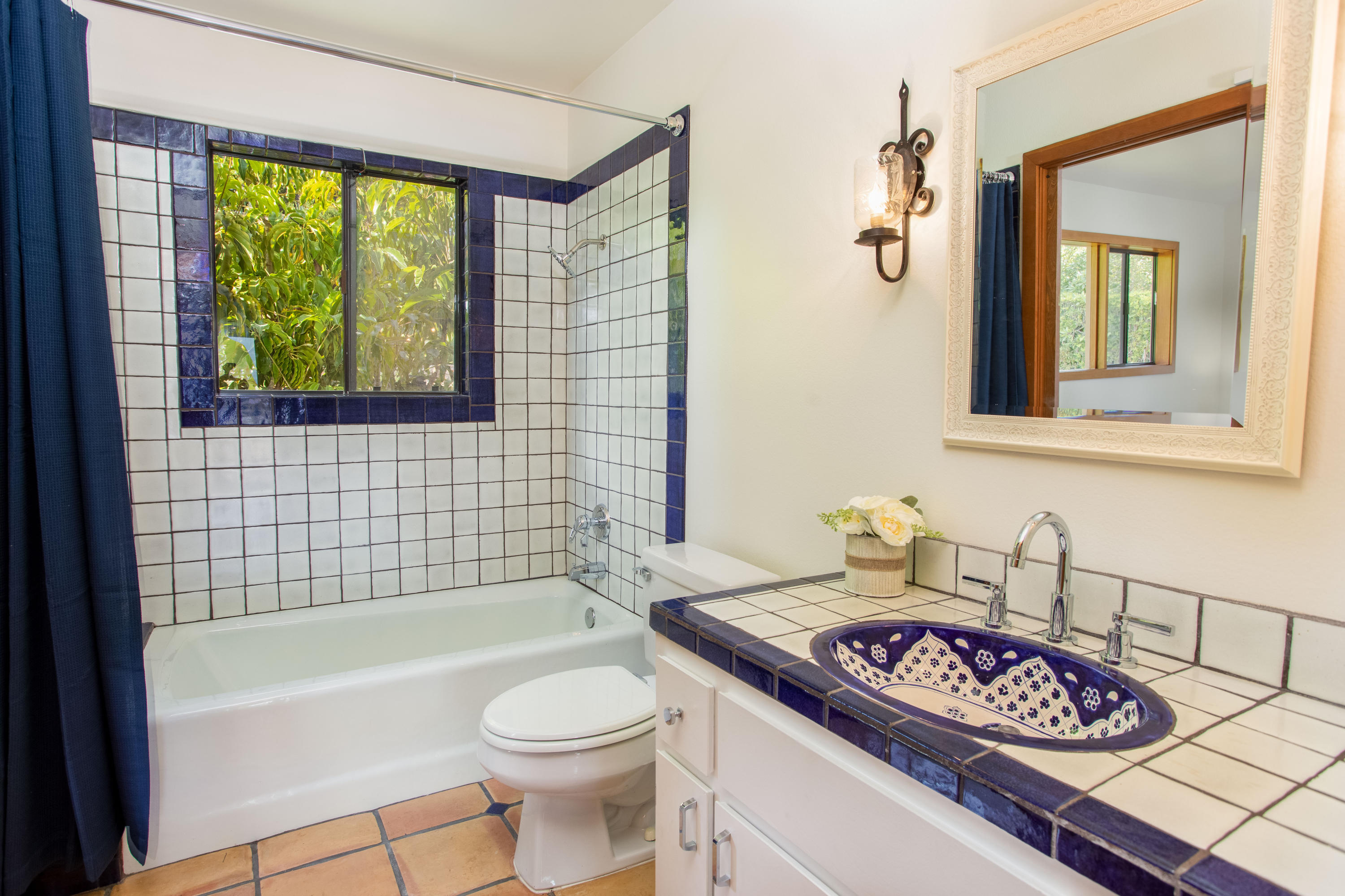 624 Las Alturas Road Santa Barbara, CA 93103 - Photo 21 of 40 a bathroom with a granite countertop sink and a bathtub