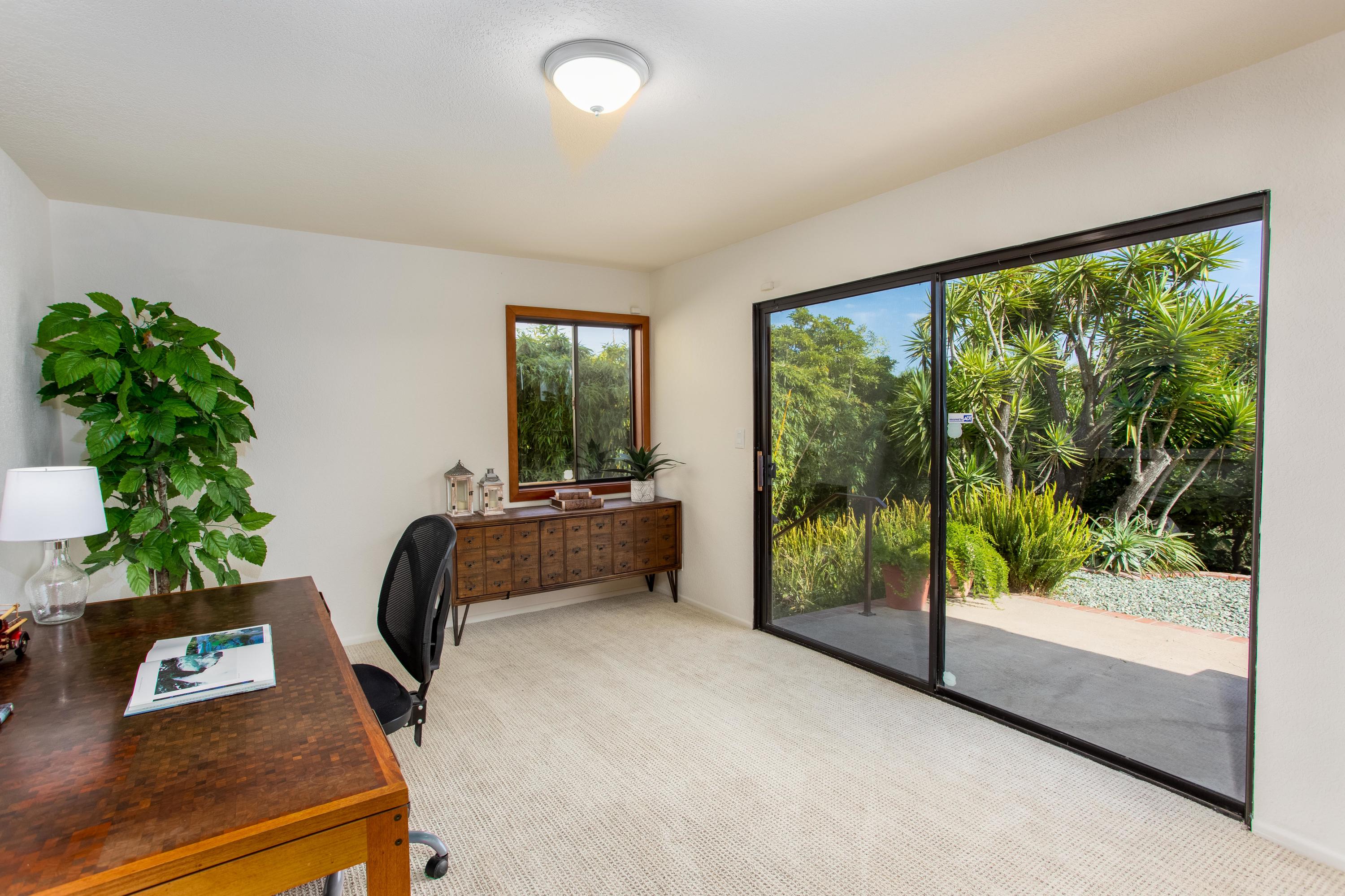 624 Las Alturas Road Santa Barbara, CA 93103 - Photo 25 of 40 a bedroom with furniture and a potted plant