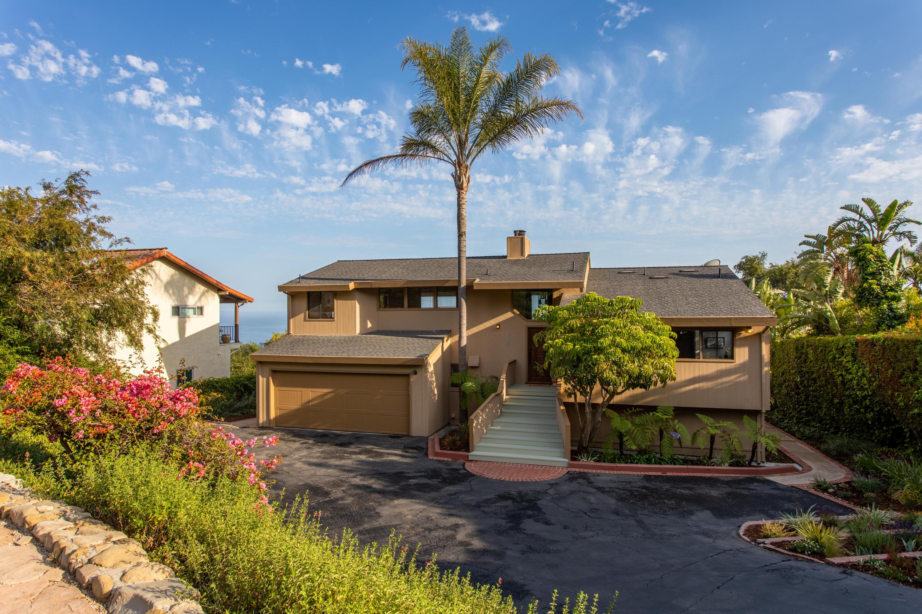 624 Las Alturas Road Santa Barbara, CA 93103 - Photo 3 of 40 a front view of a house with a yard