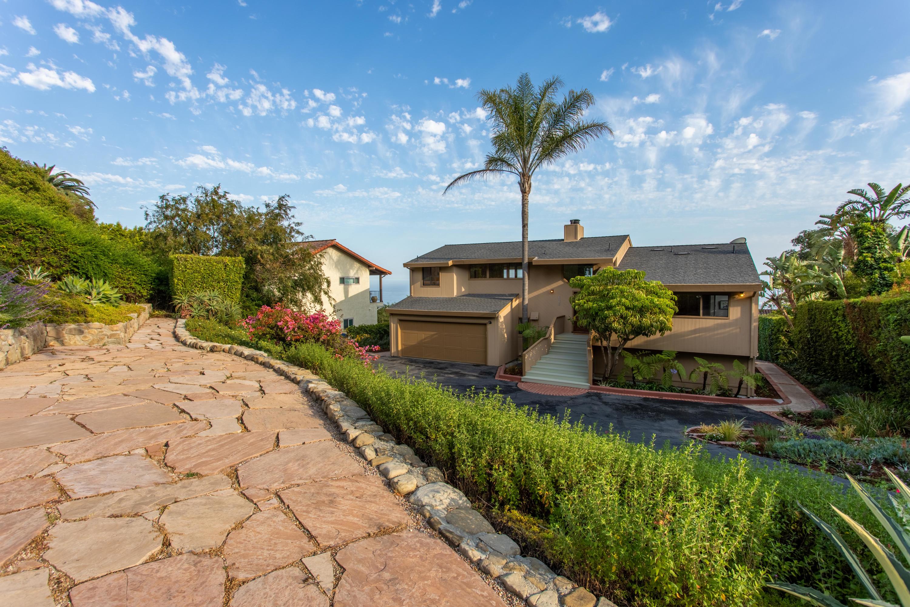 624 Las Alturas Road Santa Barbara, CA 93103 - Photo 32 of 40 a front view of a house with a yard