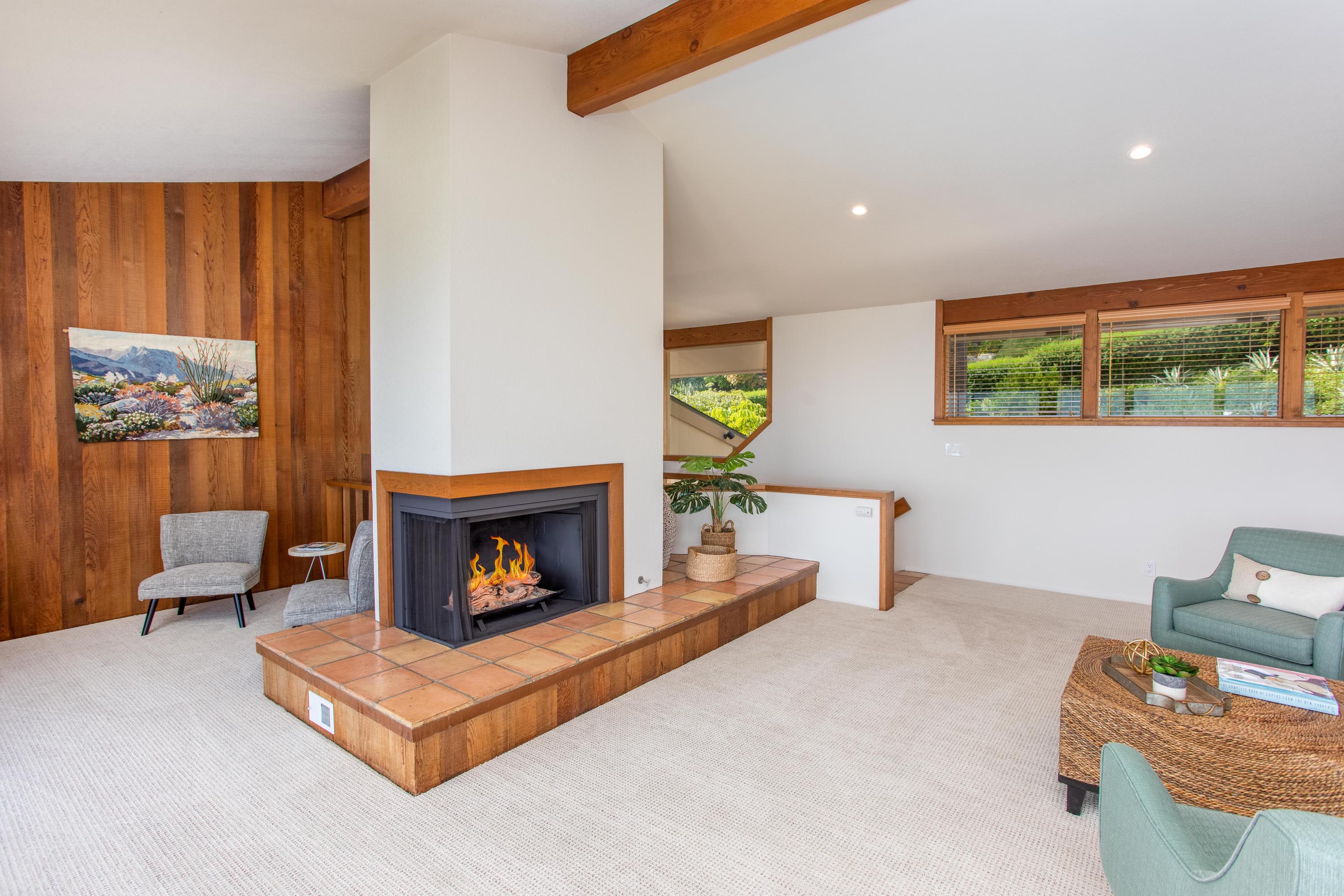 624 Las Alturas Road Santa Barbara, CA 93103 - Photo 6 of 40 a living room with furniture and a fireplace