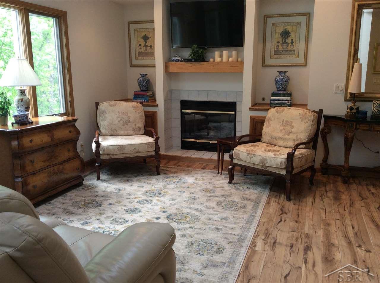 8241 Midland Road Freeland, MI 48623 - Photo 21 of 24 Enjoy the cozy gas fireplace in the relaxing living room