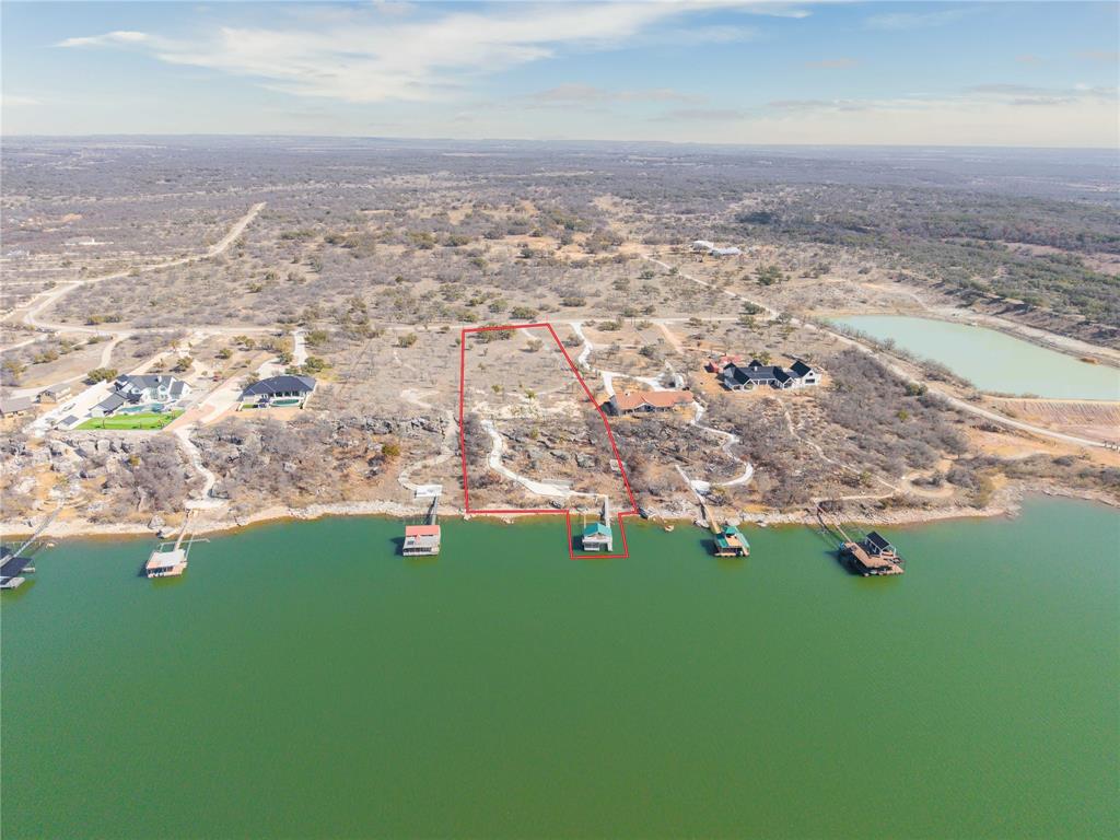 975 Deep Water Road May, TX 76857 - Photo 3 of 27 an aerial view of residential houses with outdoor space and trees