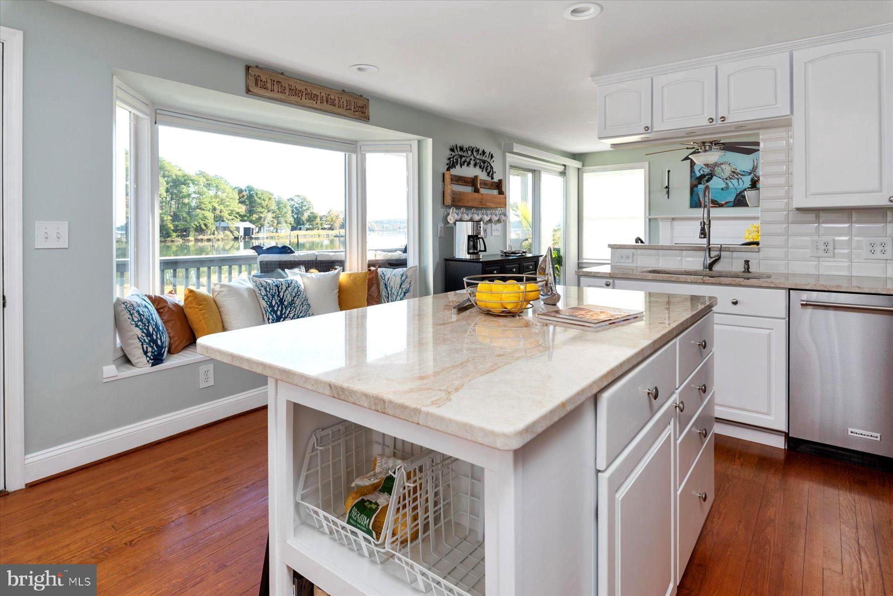 6489 Bozman Neavitt Road Neavitt, MD 21652 - Photo 11 of 37 Quartz Counters & Island & a built in window bench