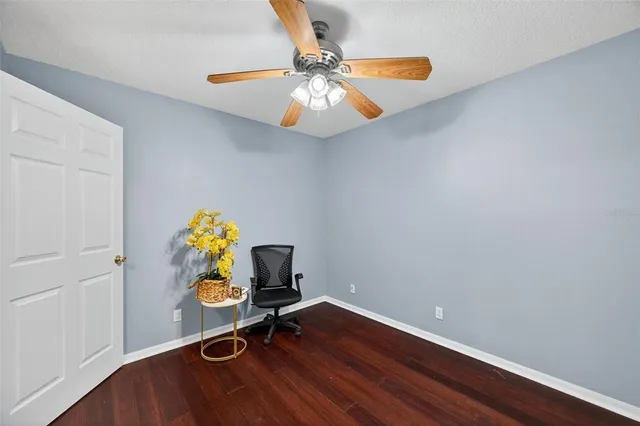 a workspace with furniture and wooden floor