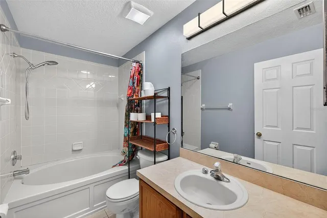 a room with furniture and a potted plant