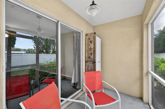 a room with furniture and a potted plant