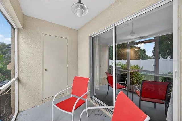 a view of a swimming pool with a patio and a garden