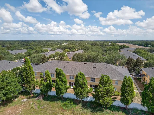 an aerial view of a house with a garden