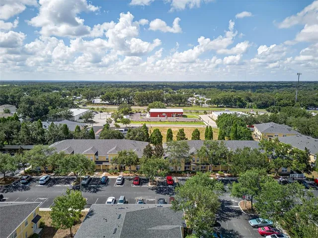 an aerial view of a house having yard