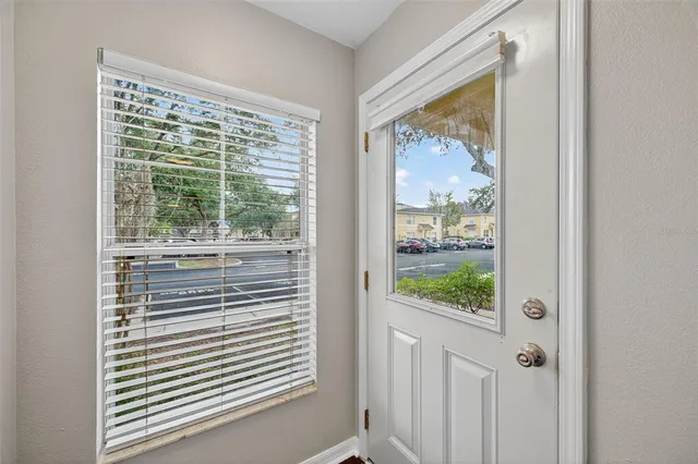 a view of a door and a window