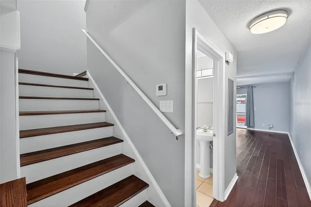 a view of entryway and hall with wooden floor