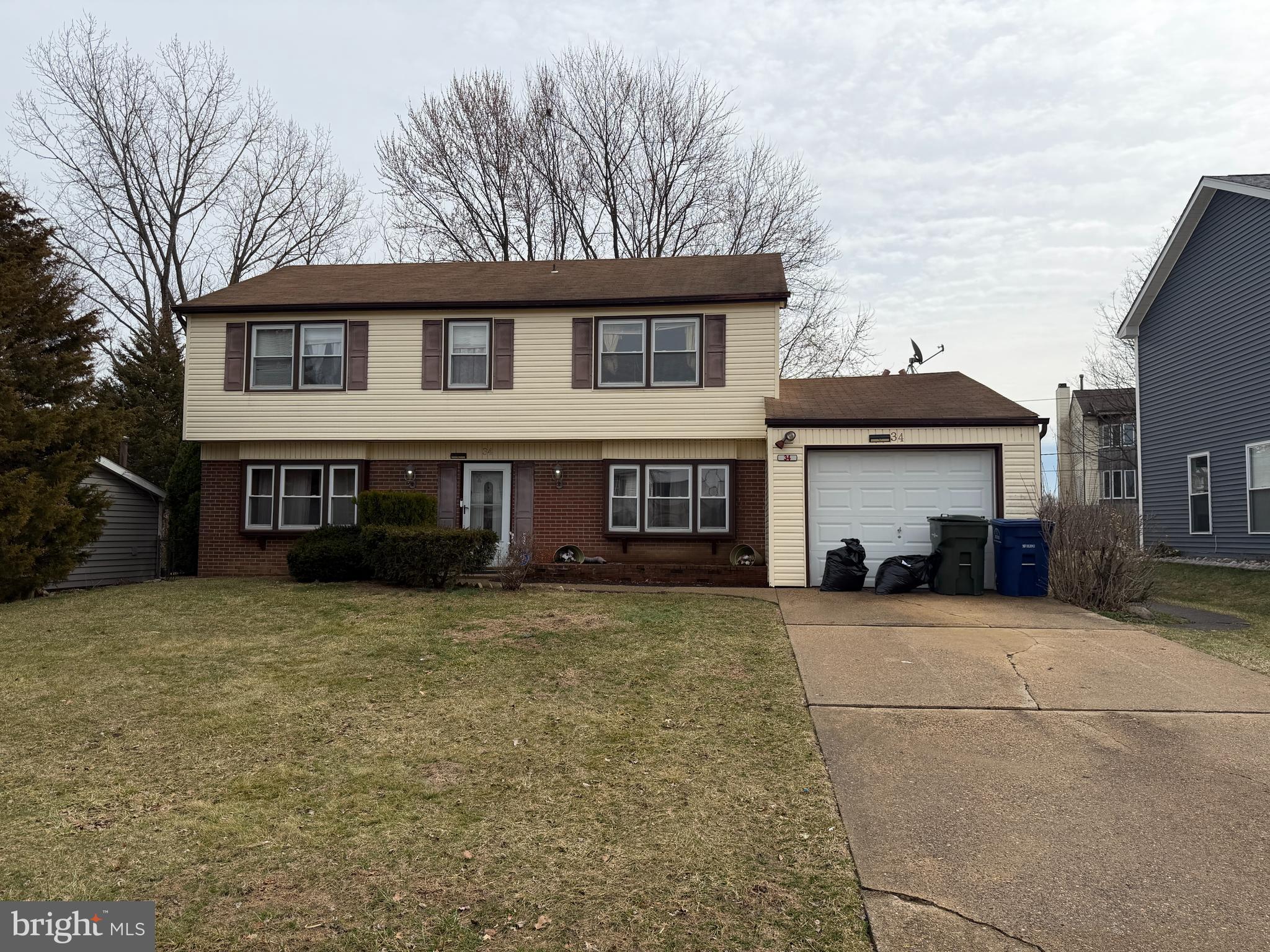 34 Mayfair Circle Willingboro, NJ 08046 - Photo 1 of 35 a front view of a house with a yard and garage