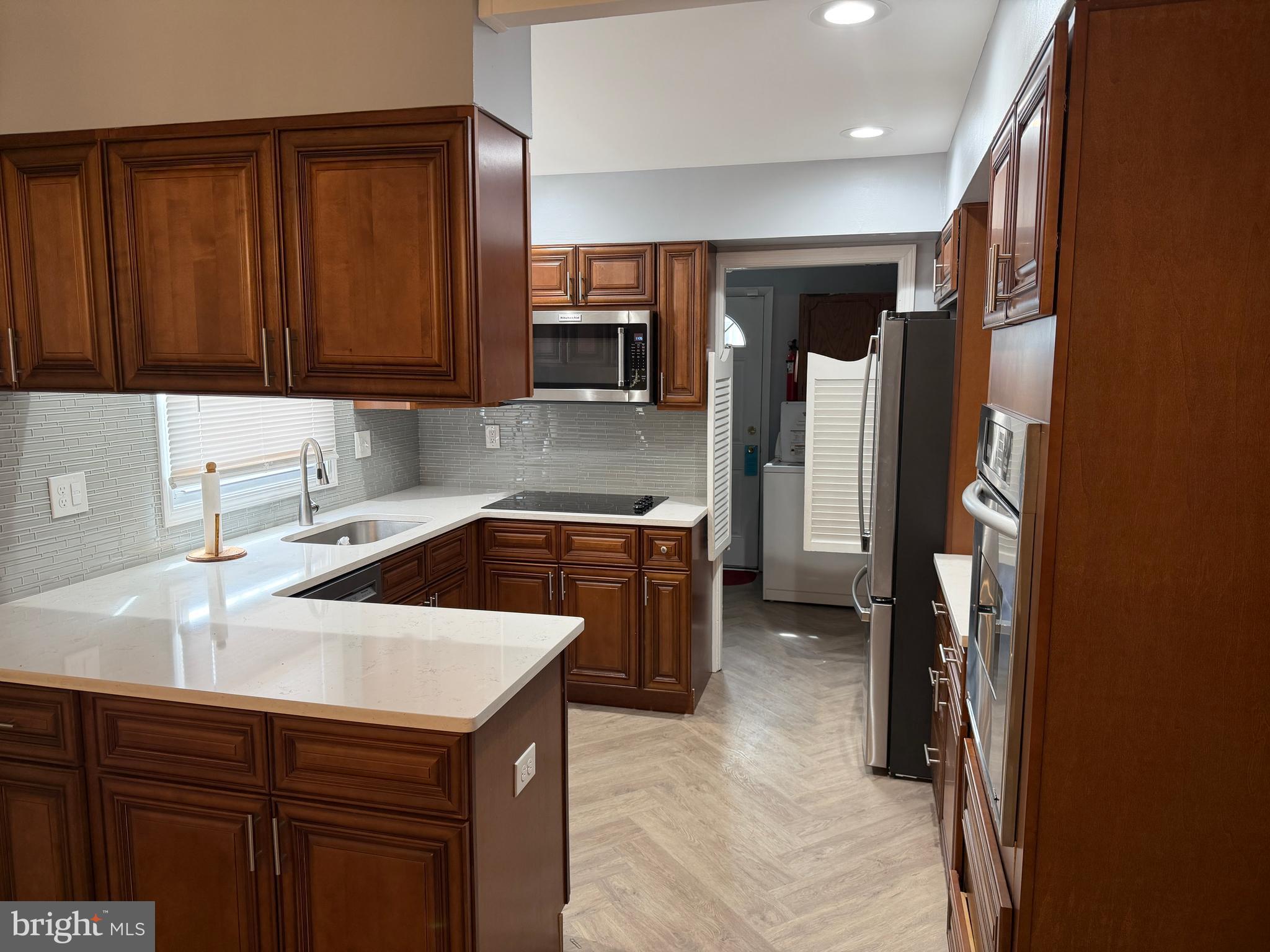 34 Mayfair Circle Willingboro, NJ 08046 - Photo 11 of 35 a kitchen that has a sink a stove and cabinets