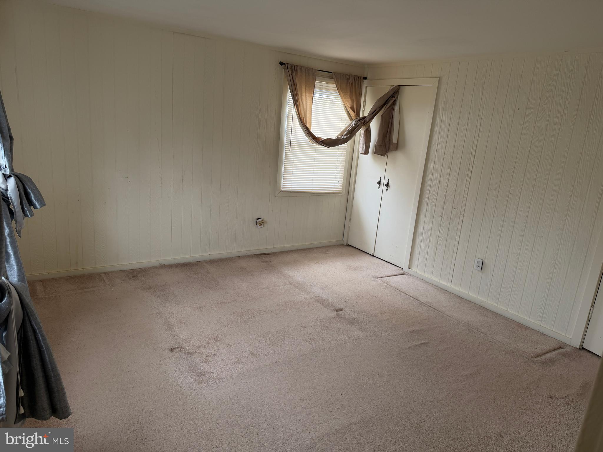 34 Mayfair Circle Willingboro, NJ 08046 - Photo 17 of 35 an empty room with mirror and a window