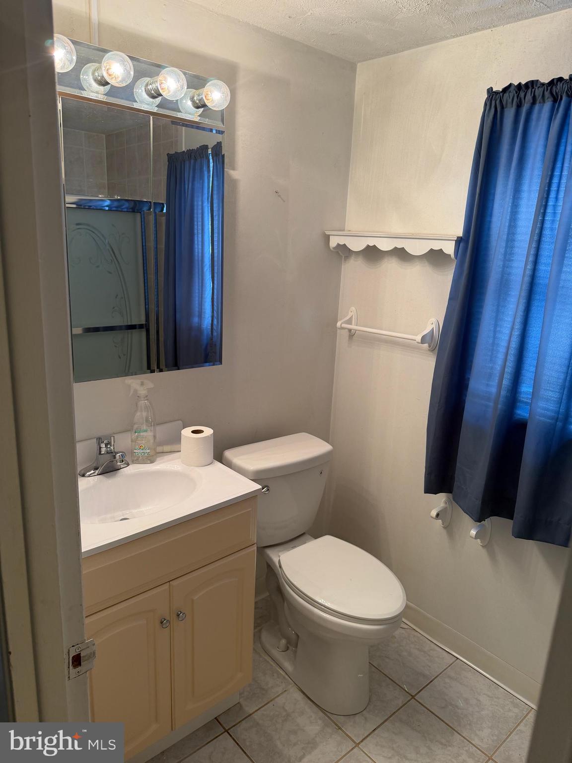 34 Mayfair Circle Willingboro, NJ 08046 - Photo 23 of 35 a bathroom with a toilet a sink and mirror