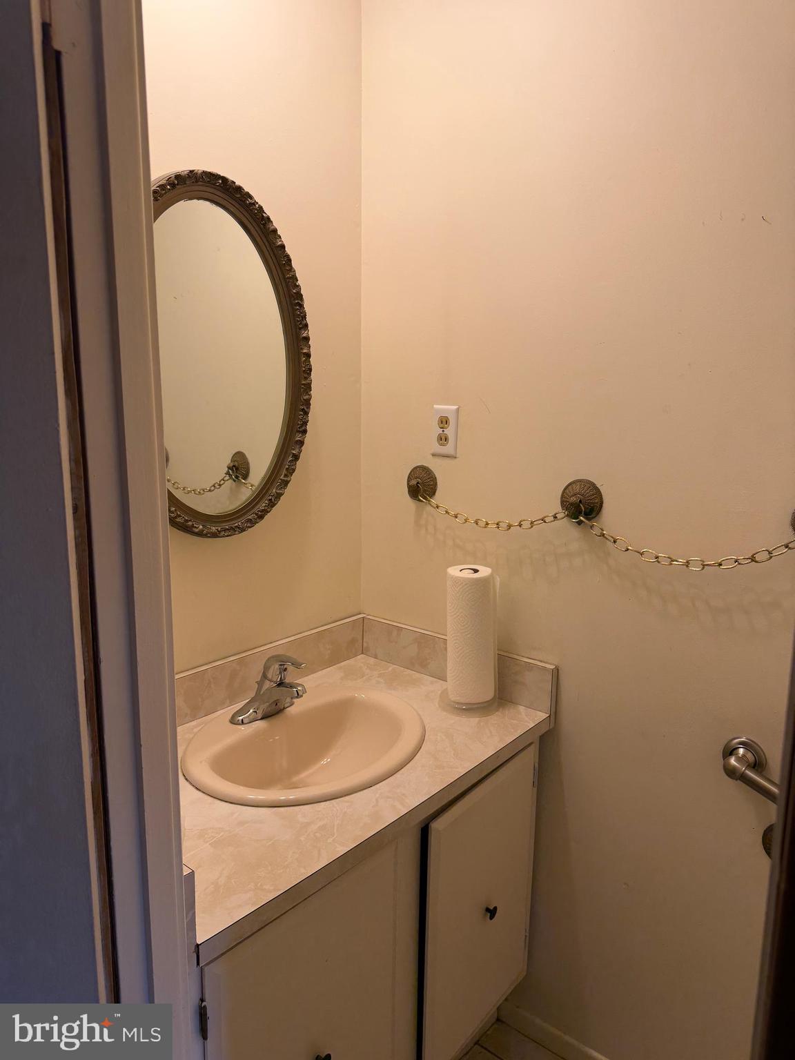 34 Mayfair Circle Willingboro, NJ 08046 - Photo 6 of 35 a bathroom with a sink and a mirror