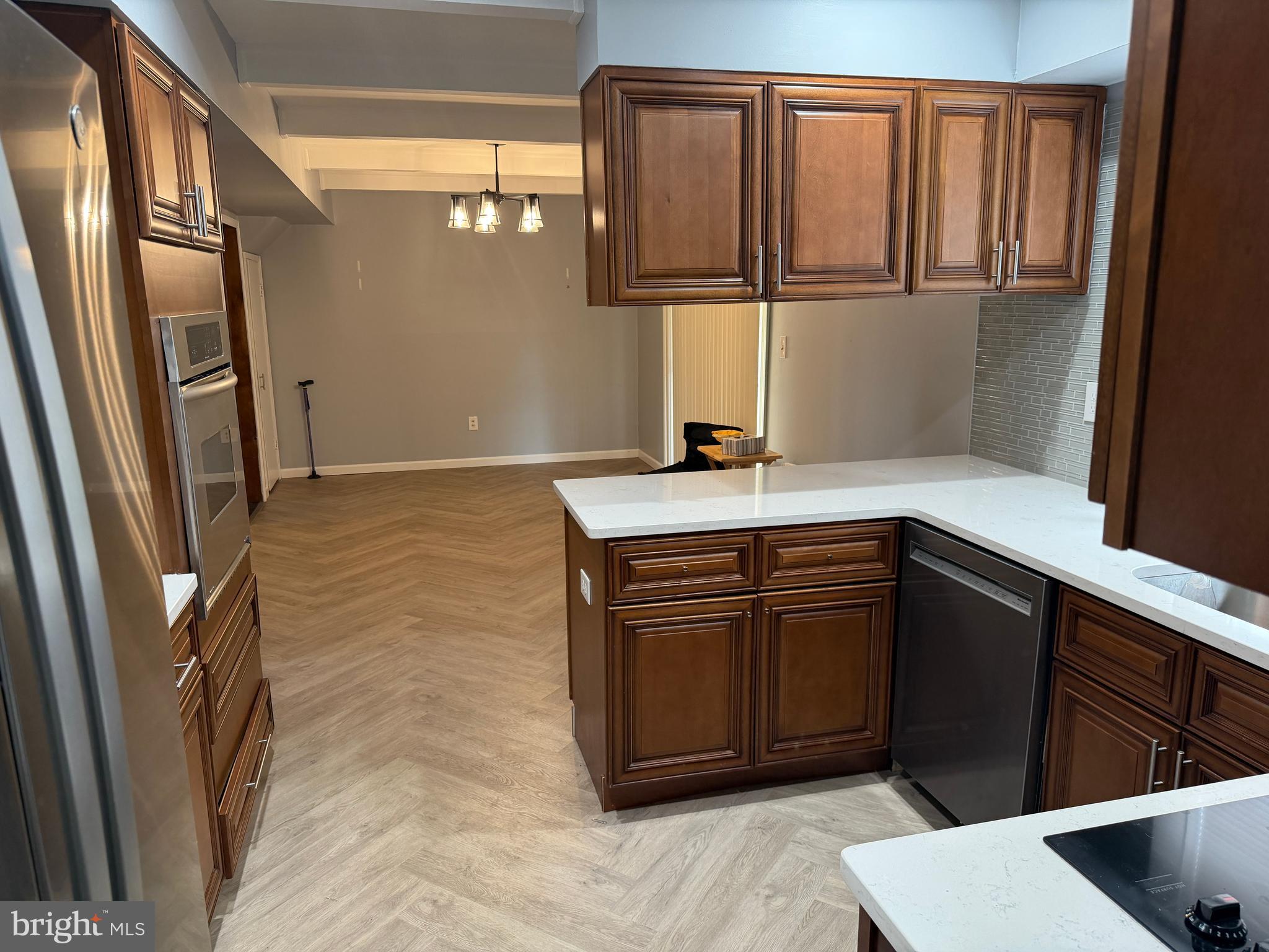 34 Mayfair Circle Willingboro, NJ 08046 - Photo 10 of 35 a kitchen with granite countertop a refrigerator and a sink