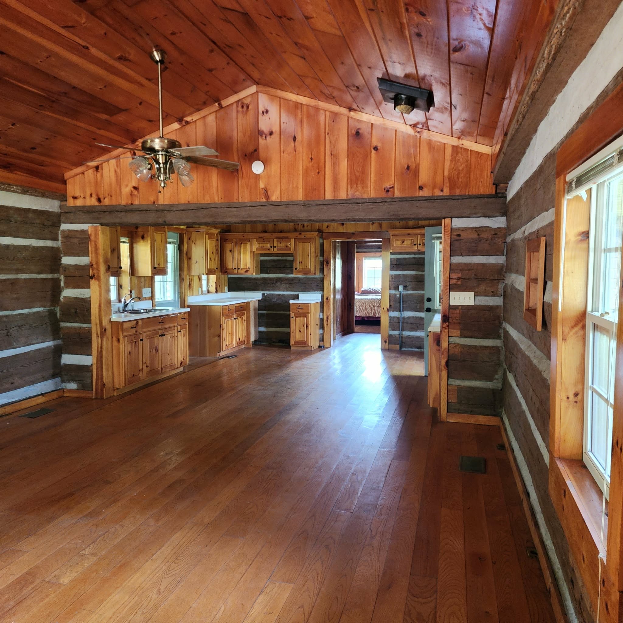 145 Mrs Gower Road Lawrenceburg, TN 38464 - Photo 5 of 26 an empty room with wooden floor and windows