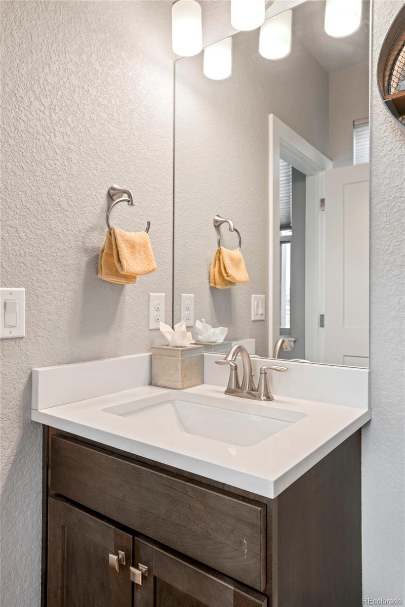 460 Elk Track Circle Granby, CO 80446 - Photo 11 of 26 a bathroom with a sink and a mirror