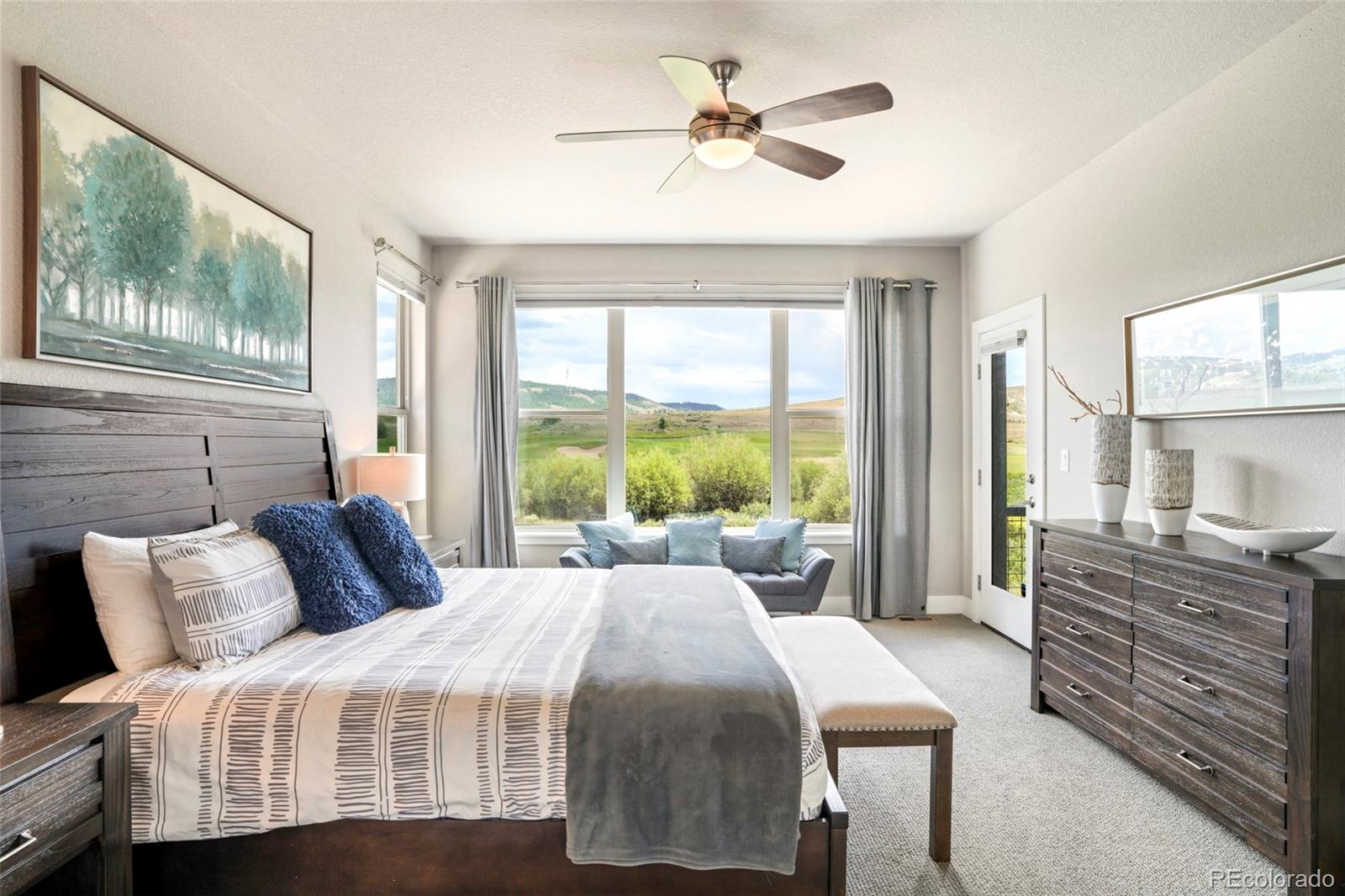 460 Elk Track Circle Granby, CO 80446 - Photo 12 of 26 a bedroom with a balcony a bed and a chandelier