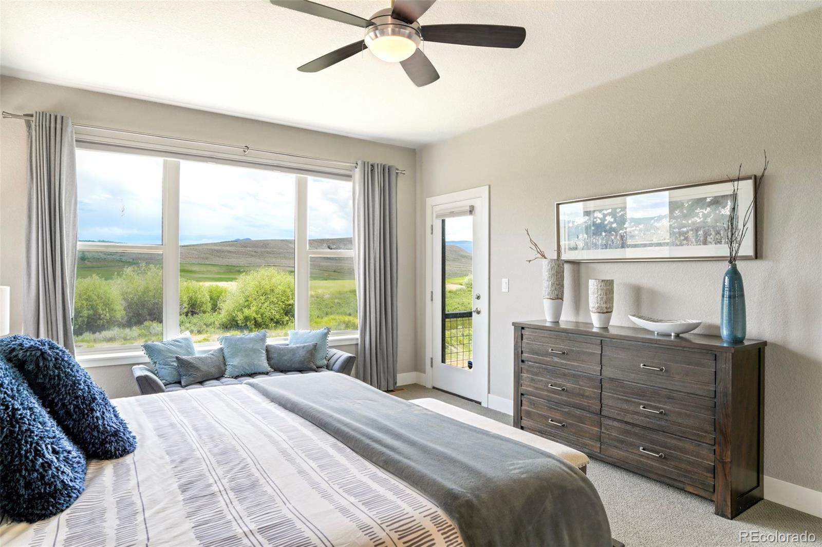 460 Elk Track Circle Granby, CO 80446 - Photo 14 of 26 a bedroom with a bed dresser and a window