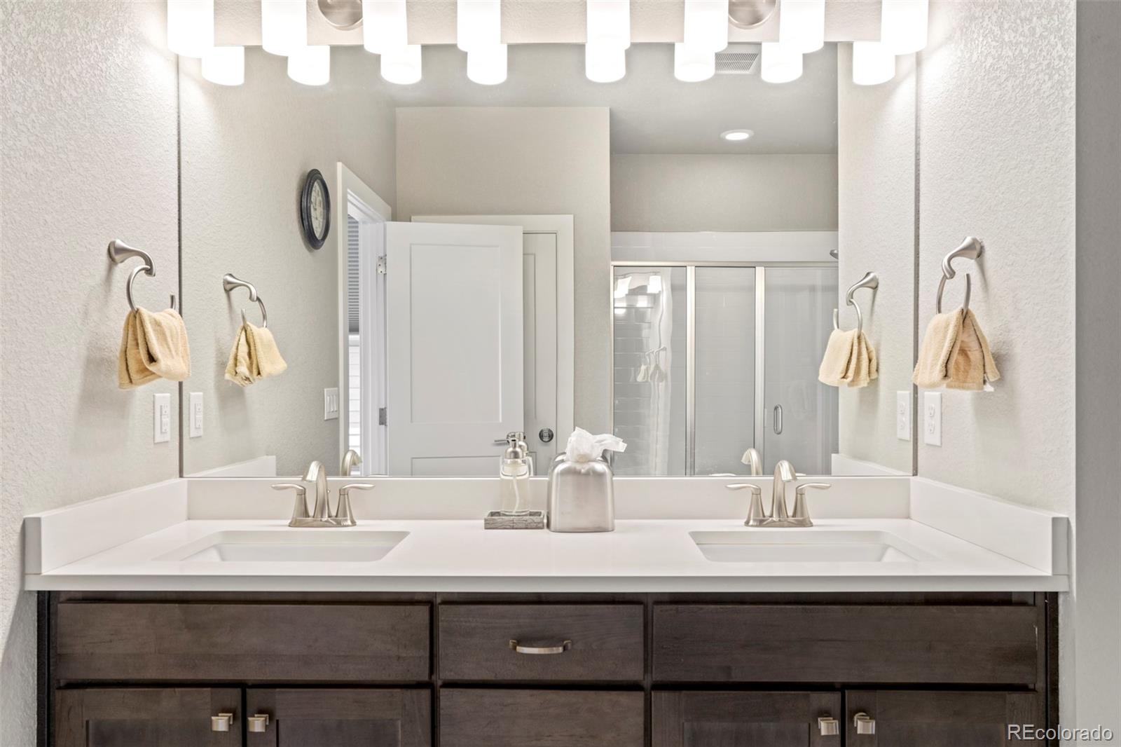 460 Elk Track Circle Granby, CO 80446 - Photo 15 of 26 a bathroom with double vanity sinks and a mirror