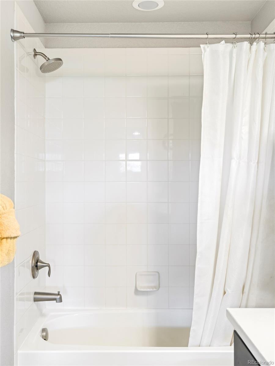 460 Elk Track Circle Granby, CO 80446 - Photo 21 of 26 a bathroom with a shower curtain and a sink
