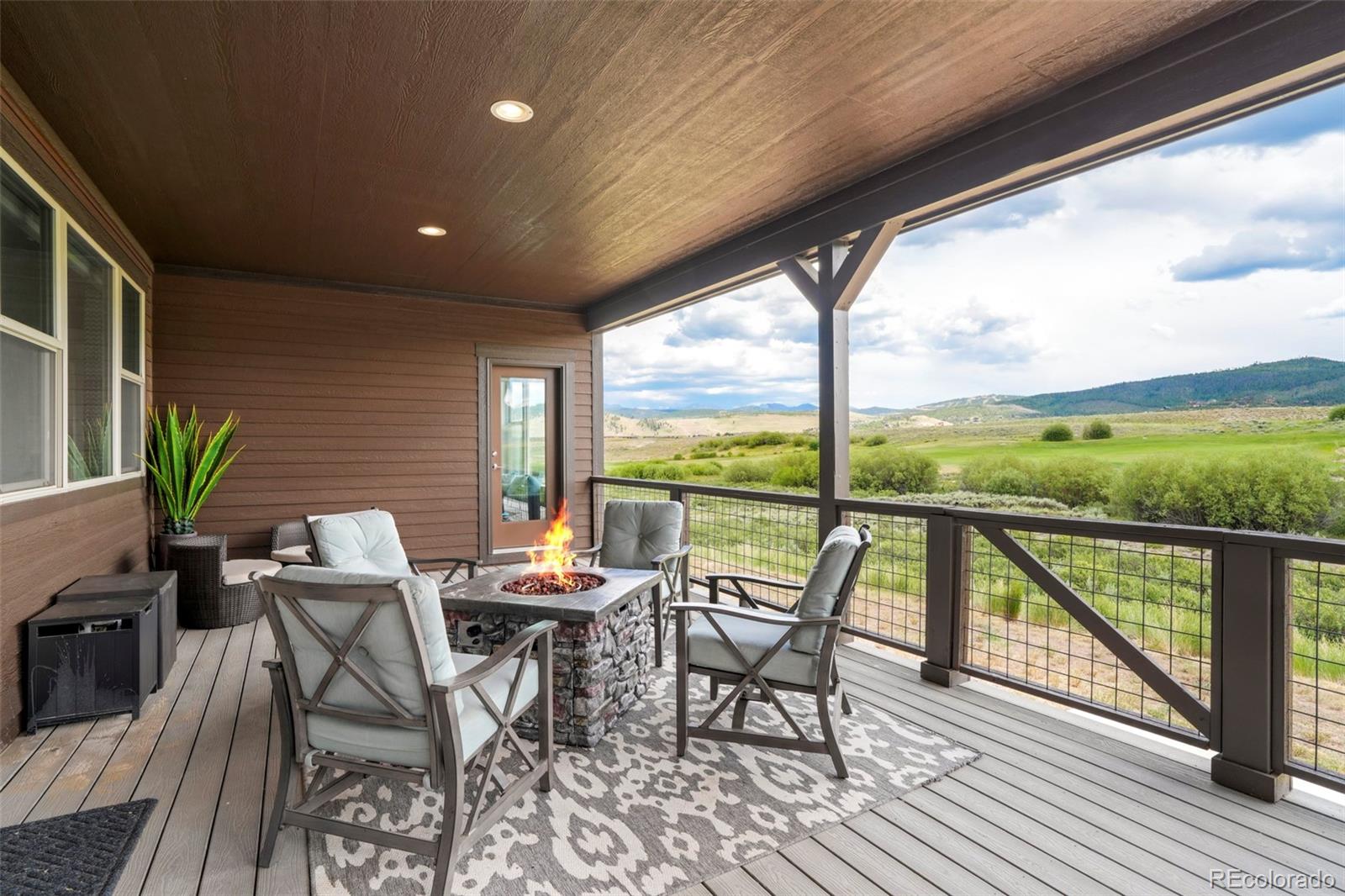 460 Elk Track Circle Granby, CO 80446 - Photo 24 of 26 a view of a porch with furniture and wooden floor