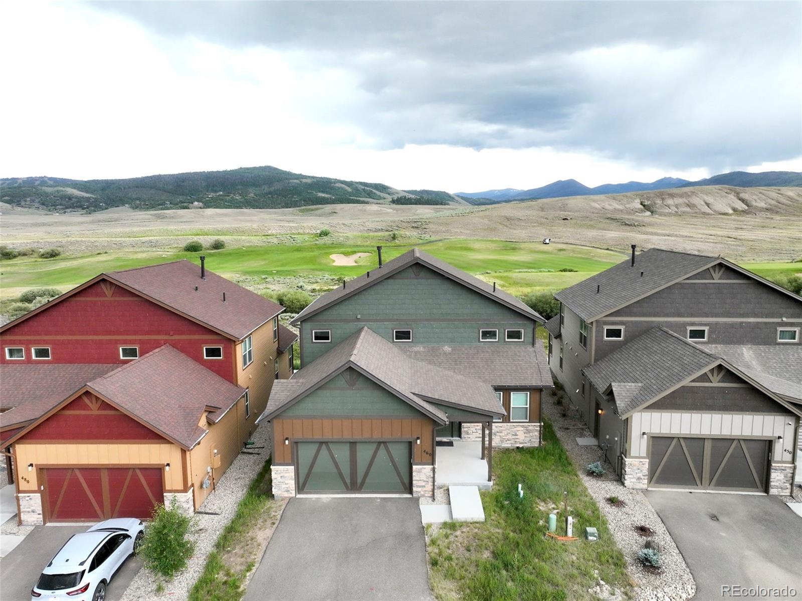 460 Elk Track Circle Granby, CO 80446 - Photo 3 of 26 an aerial view of a house with a yard and lake view