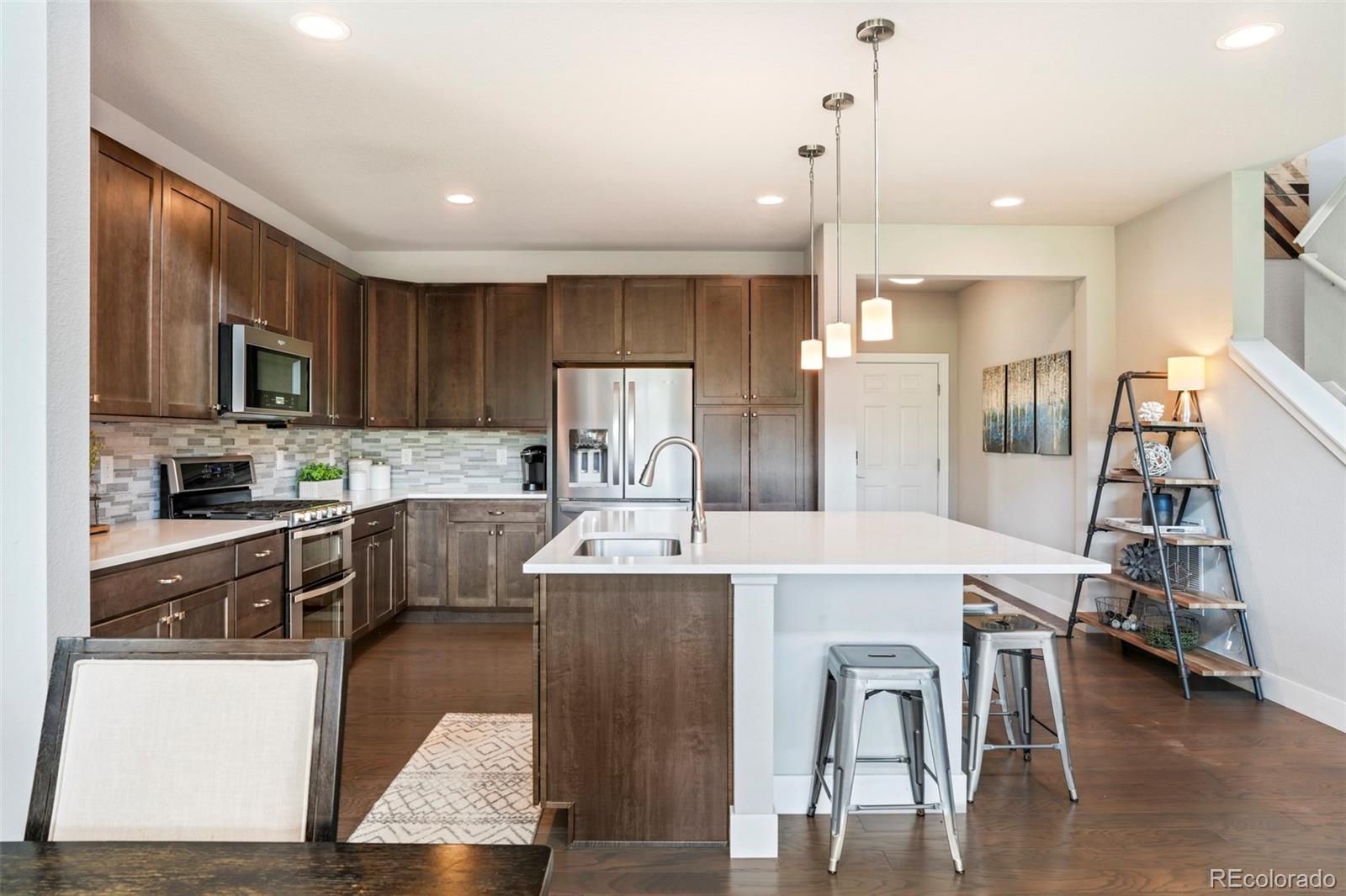 460 Elk Track Circle Granby, CO 80446 - Photo 7 of 26 a large kitchen with kitchen island a large island in the center