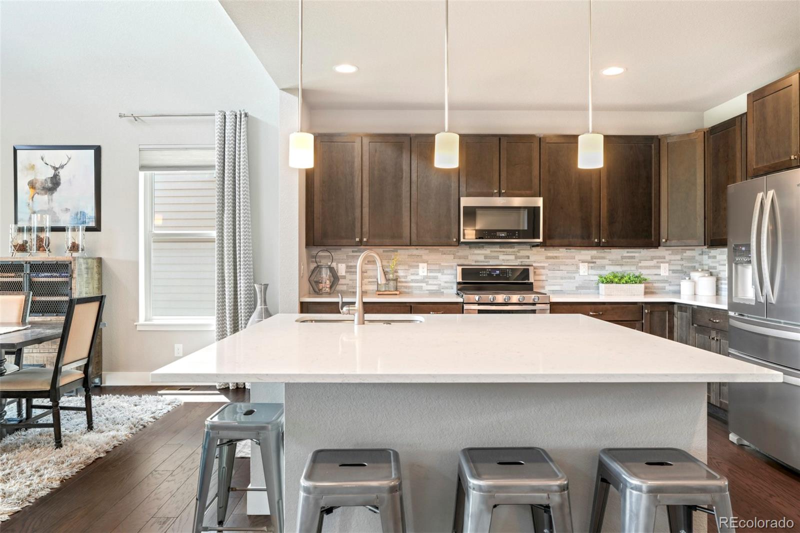 460 Elk Track Circle Granby, CO 80446 - Photo 9 of 26 a kitchen with kitchen island a counter top space appliances and cabinets