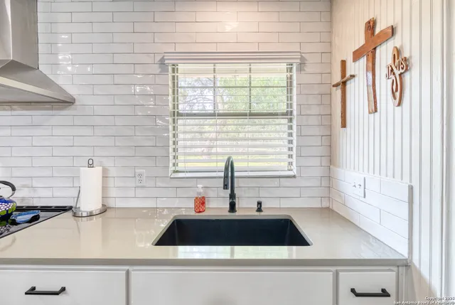 a close view of a sink and a window