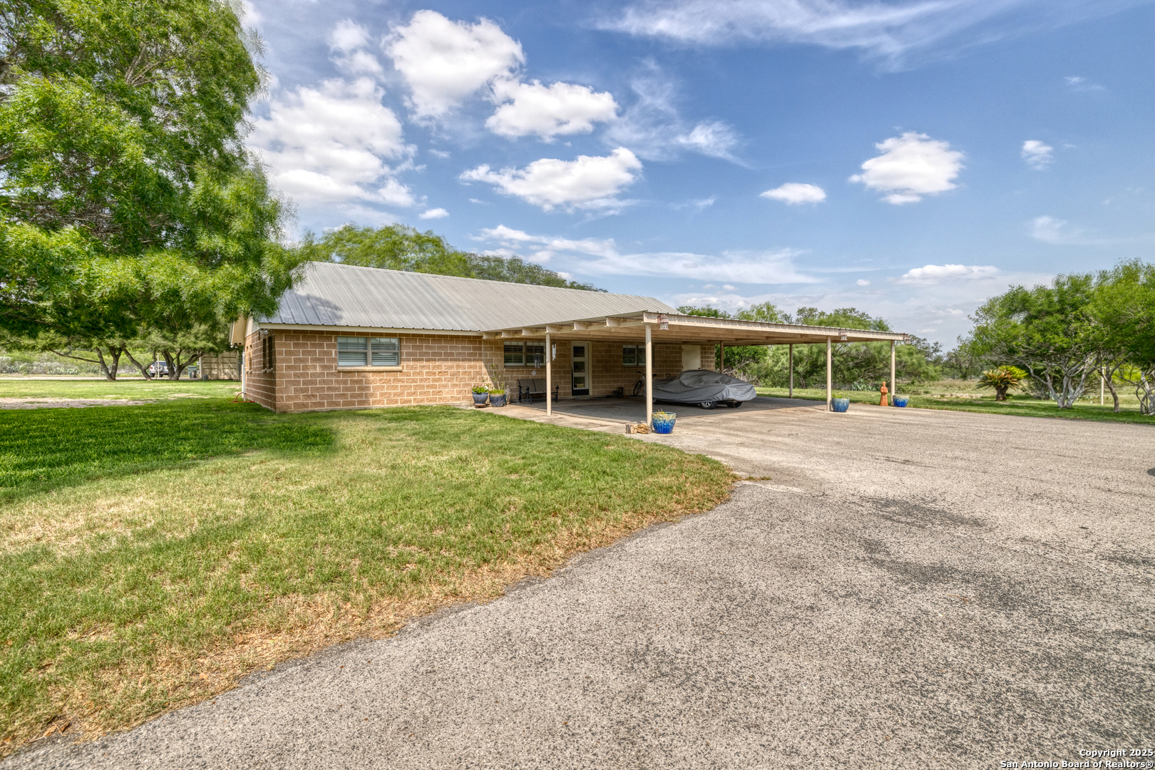 433 Mills Lane Uvalde, TX 78801 - Photo 2 of 51 front view of a house with a yard