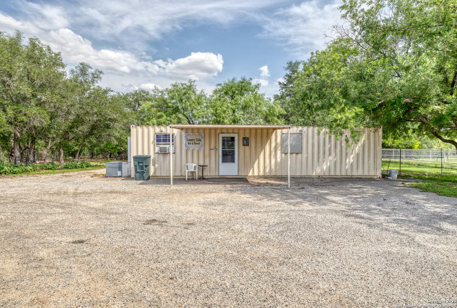 433 Mills Lane Uvalde, TX 78801 - Photo 25 of 51 a view of a house with backyard and trees
