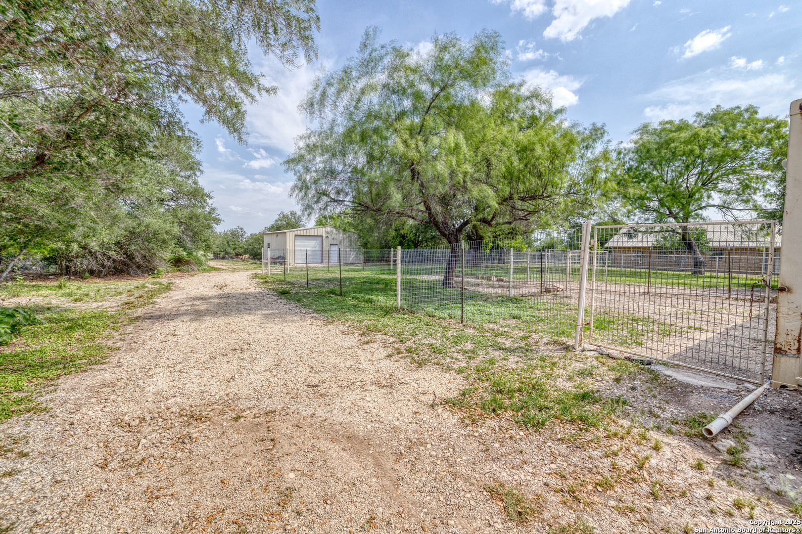 433 Mills Lane Uvalde, TX 78801 - Photo 26 of 51 a view of a yard with a tiny play house