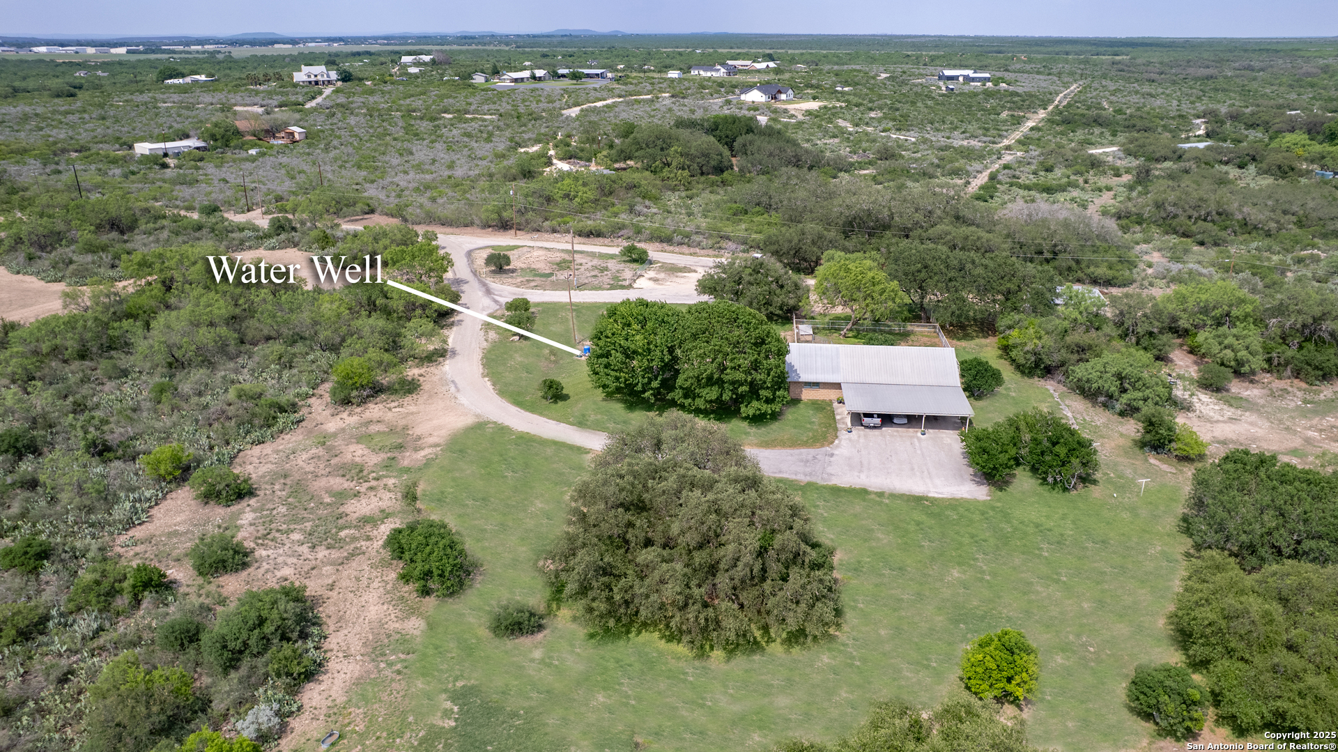 433 Mills Lane Uvalde, TX 78801 - Photo 41 of 51 an aerial view of residential houses with outdoor space and garden
