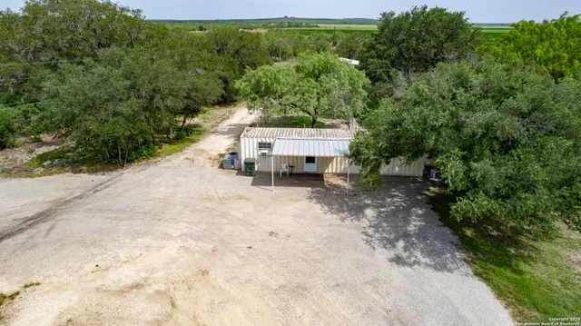 a backyard of a house with a yard and garage