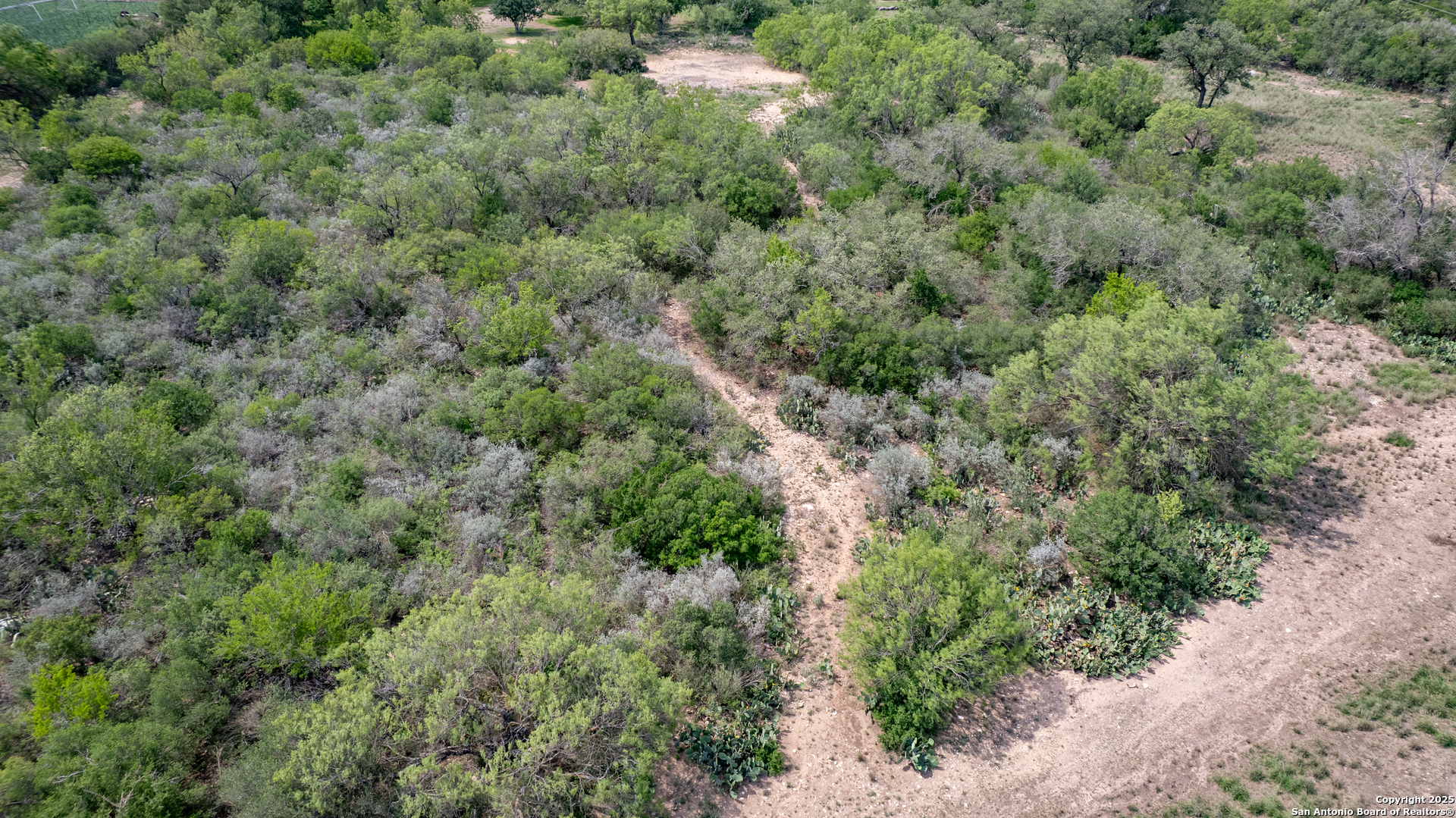 433 Mills Lane Uvalde, TX 78801 - Photo 50 of 51 an aerial view of residential house with outdoor space and trees all around