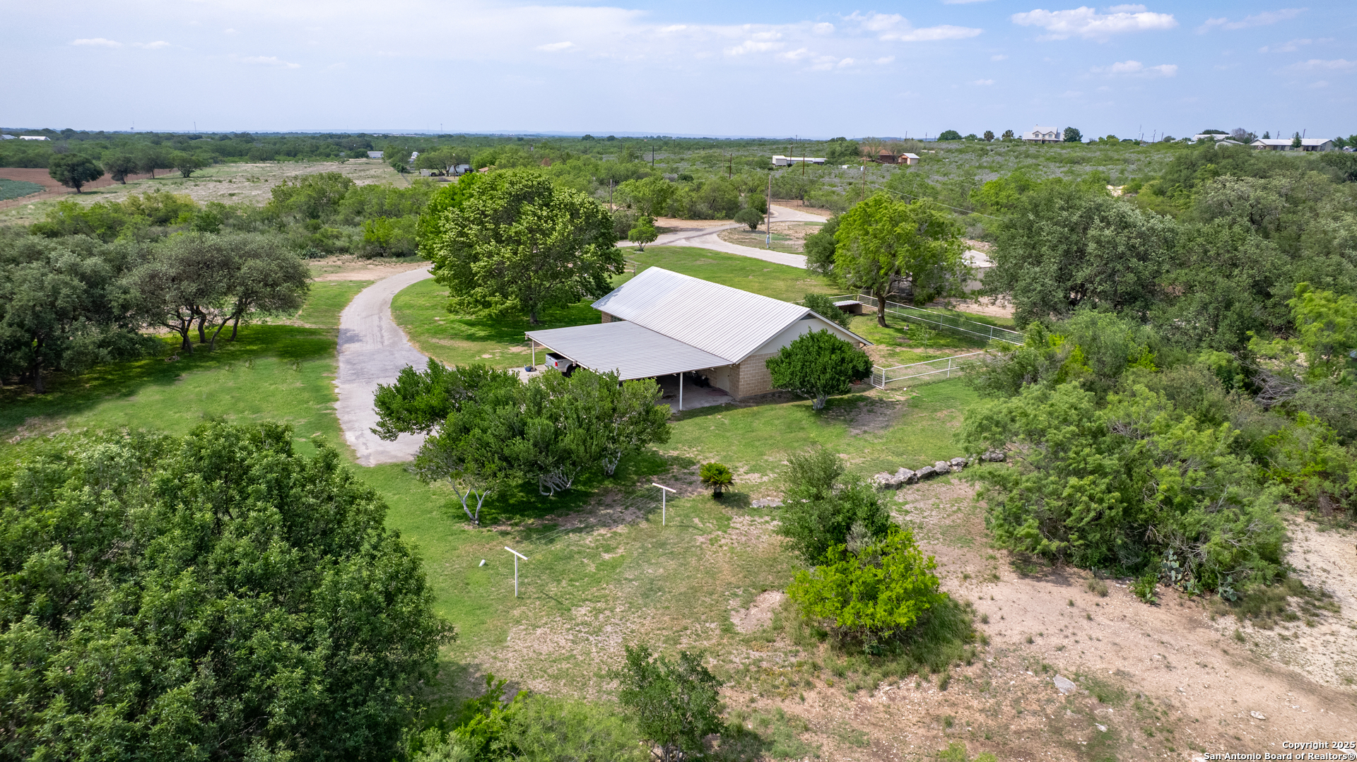 433 Mills Lane Uvalde, TX 78801 - Photo 6 of 51 an aerial view of a house with a yard and lake view