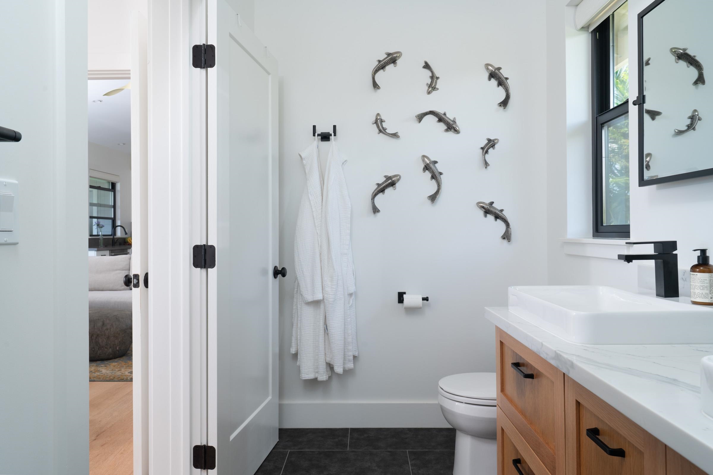 125 Hekuawa Street, Unit B Haiku, HI 96708 - Photo 27 of 50 a bathroom with a sink toilet and shower