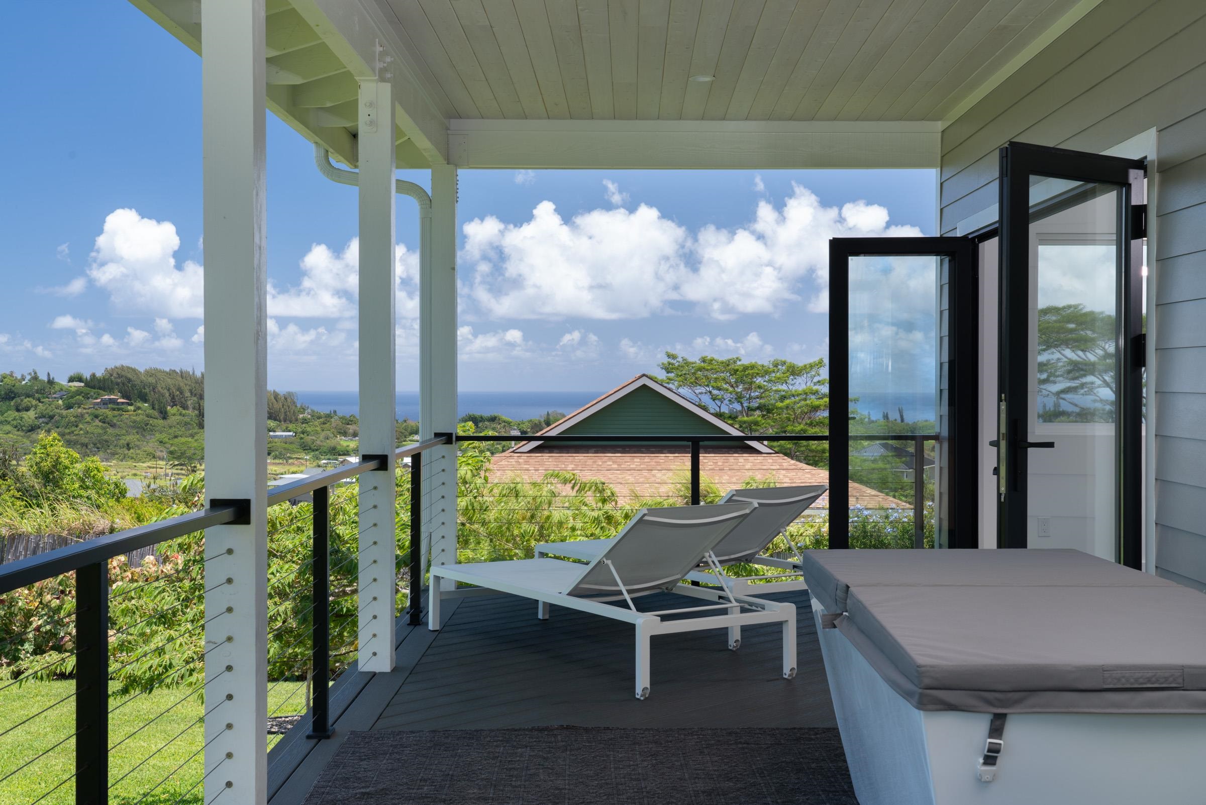125 Hekuawa Street, Unit B Haiku, HI 96708 - Photo 35 of 50 a view of a patio with table and chairs and wooden floor