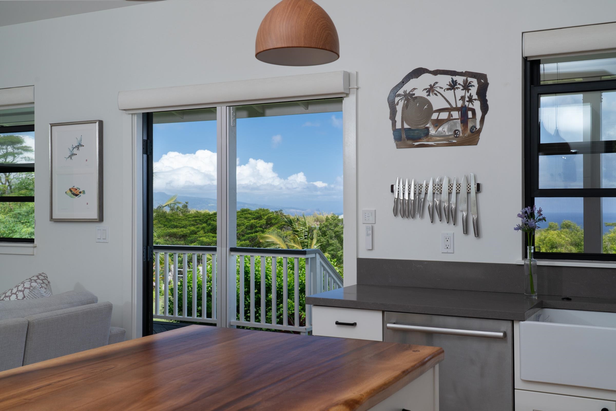 125 Hekuawa Street, Unit B Haiku, HI 96708 - Photo 7 of 50 a kitchen with a stove and a white refrigerator