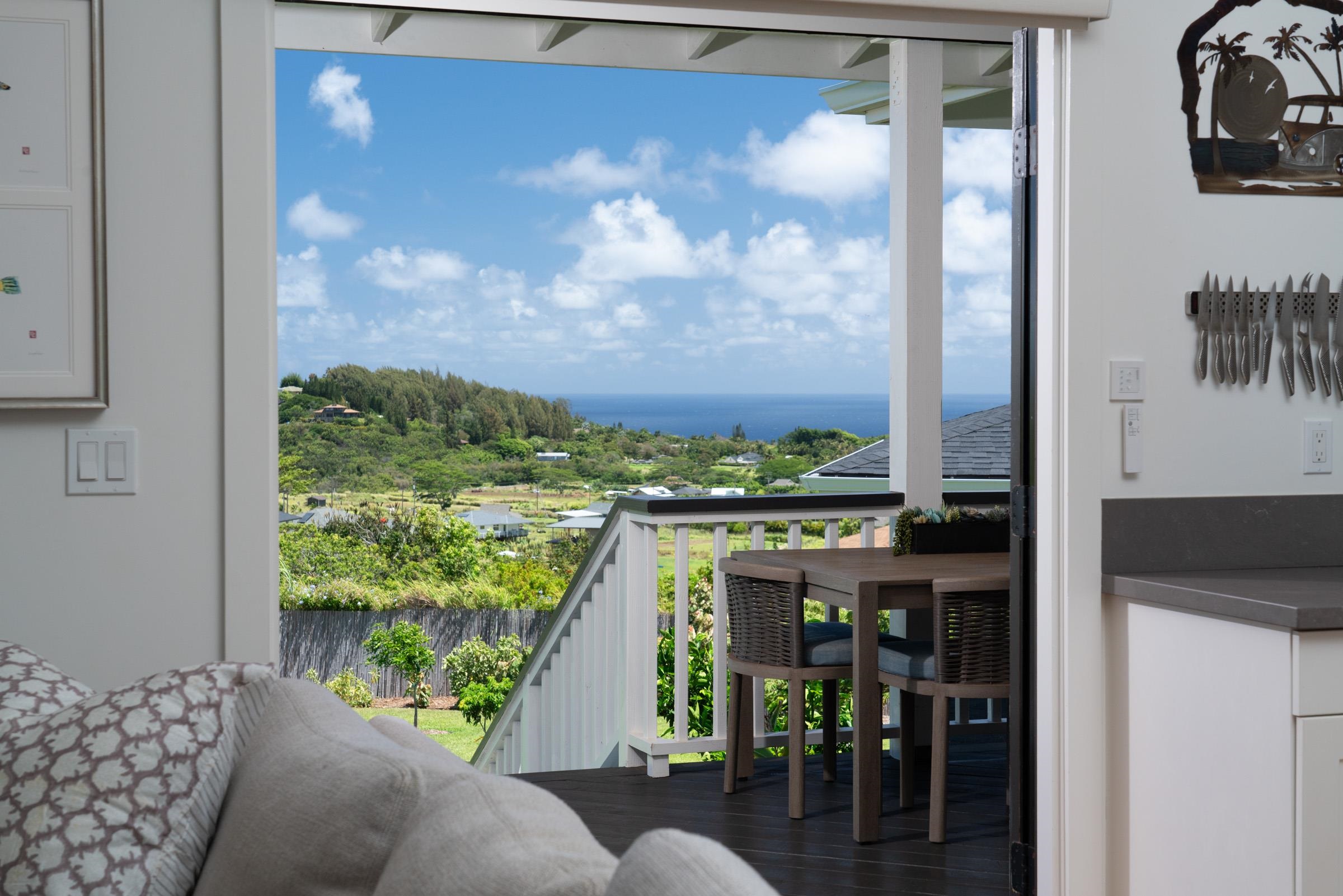 125 Hekuawa Street, Unit B Haiku, HI 96708 - Photo 9 of 50 a view of a balcony with chairs and front door