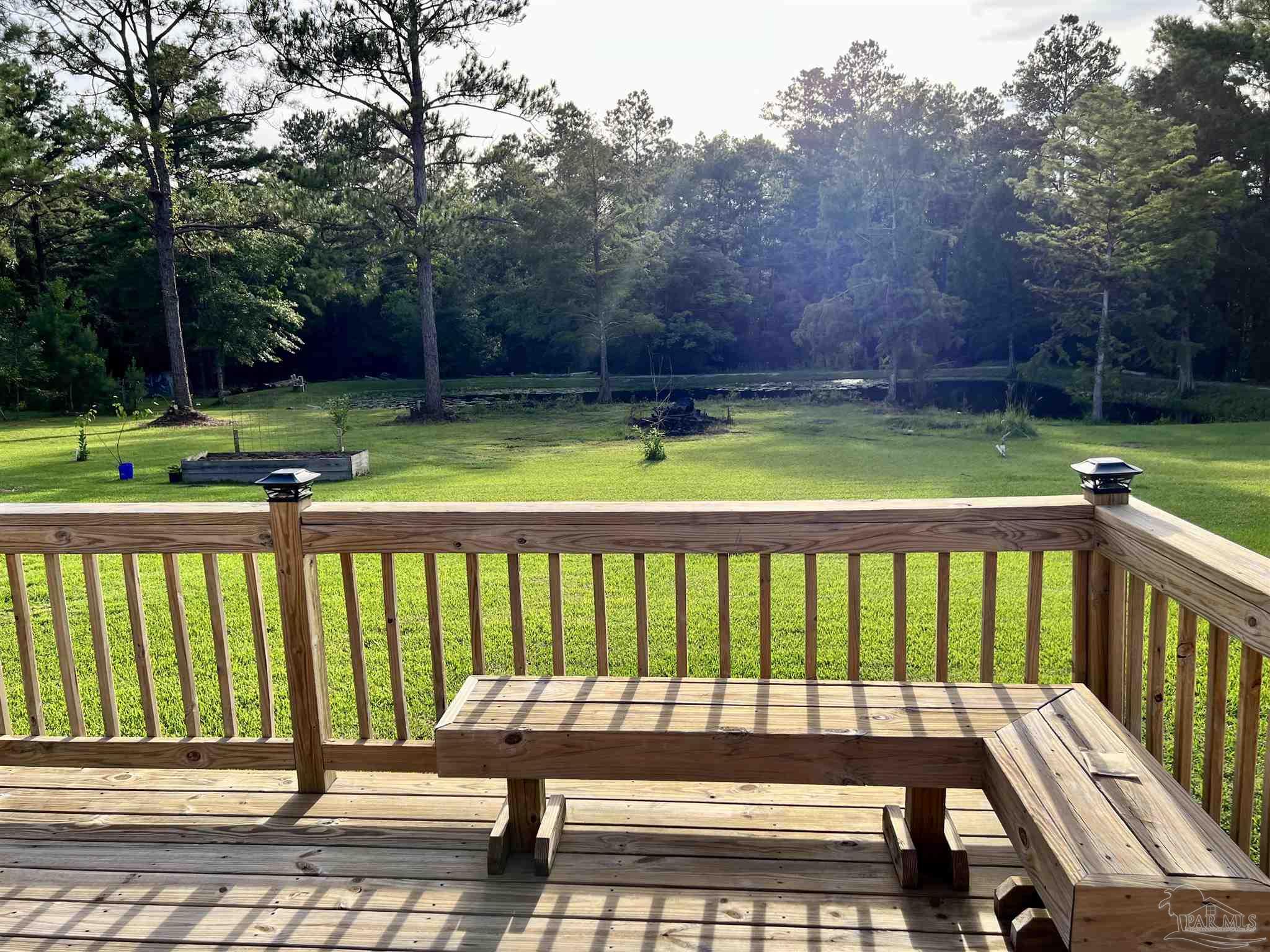 1913 Filly Road Cantonment, FL 32533 - Photo 7 of 50 Deck View of Backyard & Pond