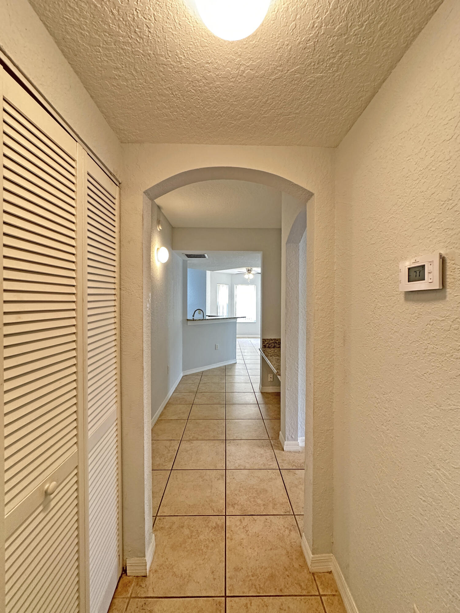 144 Southwest Peacock Boulevard, Unit 101 Port St. Lucie, FL 34986 - Photo 27 of 52 a view of a hallway