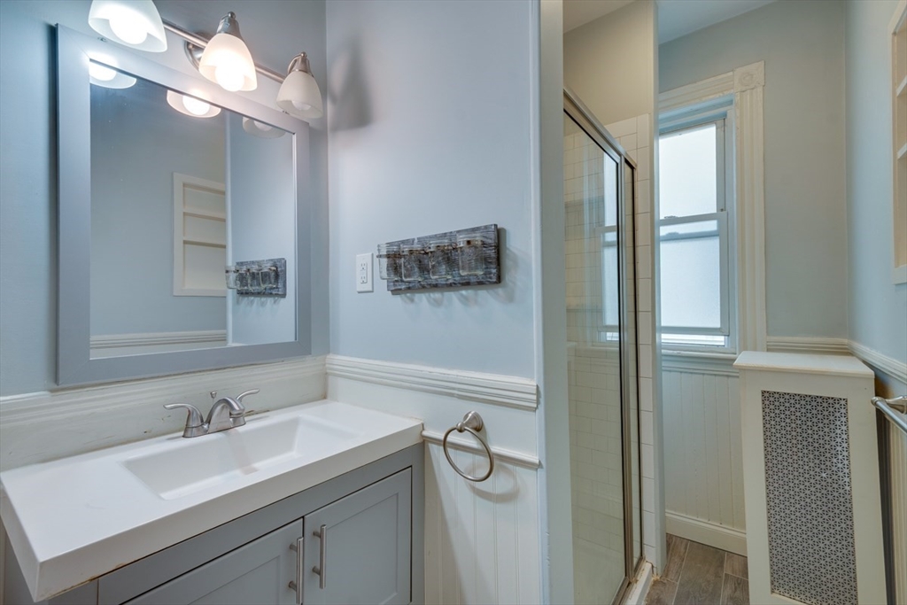 37 Taft Street Boston, MA 02125 - Photo 12 of 15 a bathroom with a sink and a mirror