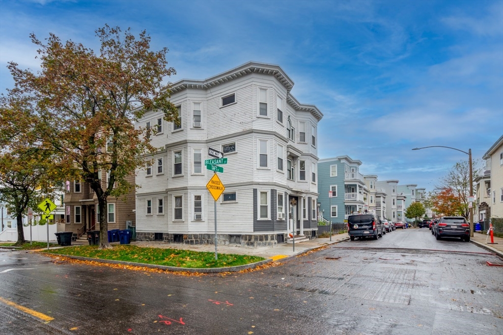 37 Taft Street Boston, MA 02125 - Photo 3 of 15 a front view of a building with cars parked