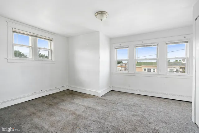 an empty room with windows