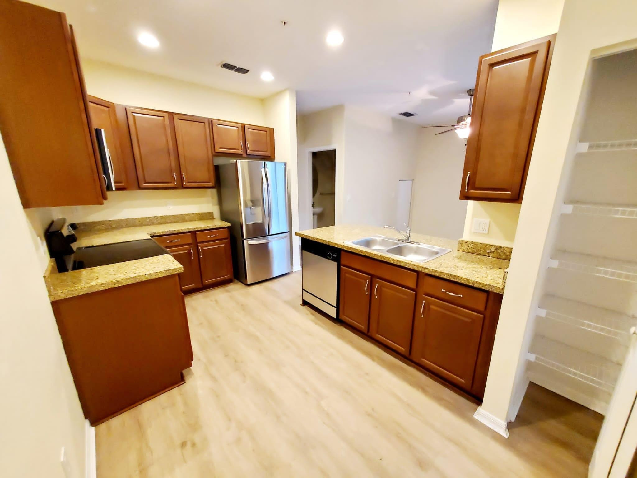2851 Prospect Road Tamarac, FL 33309 - Photo 11 of 21 a kitchen with stainless steel appliances a refrigerator and a stove